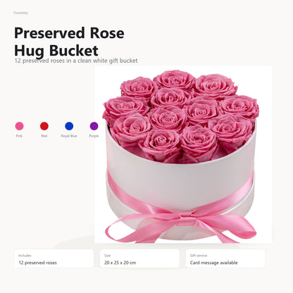 Preserved rose hug bucket with 12 roses in a white gift bucket